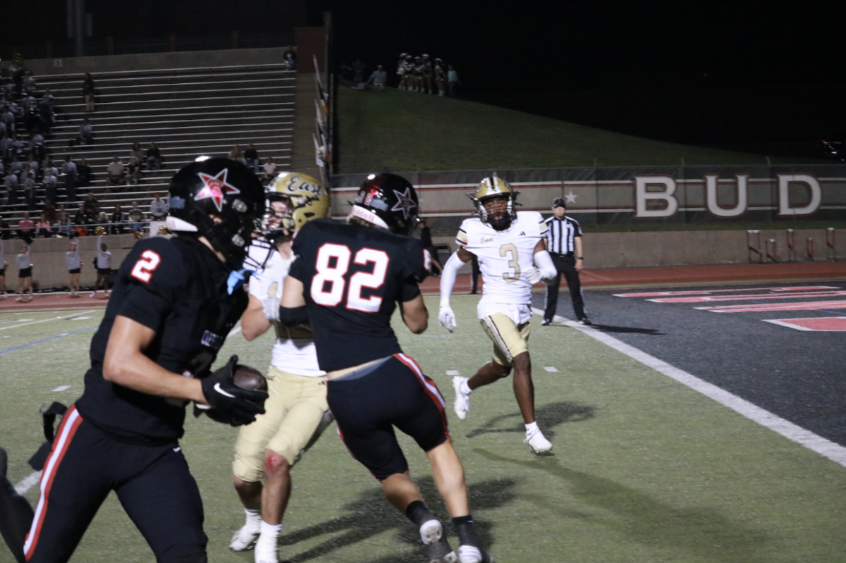 Coppell senior wide receiver Luca Grosoli scores a touchdown to make the score 35-0. The Cowboys defeated Plano East, 35-7, in the homecoming game Friday at Buddy Echols Field. Aliza Abidi